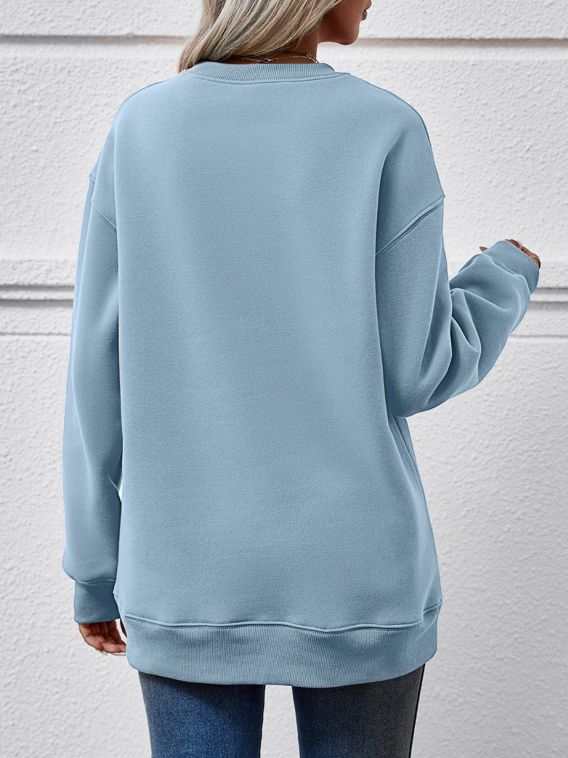 Festive ‘MERRY AND BRIGHT’ long sleeve sweatshirt, perfect for holiday cheer and cozy style.