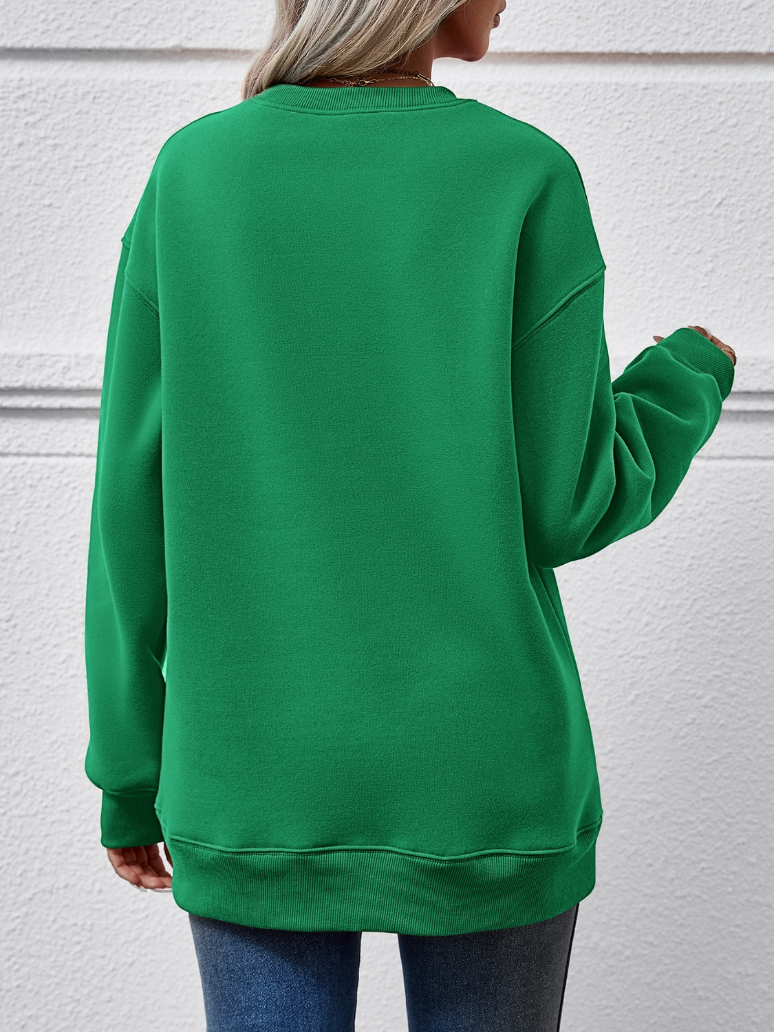 Festive ‘MERRY AND BRIGHT’ long sleeve sweatshirt, perfect for holiday cheer and cozy style.