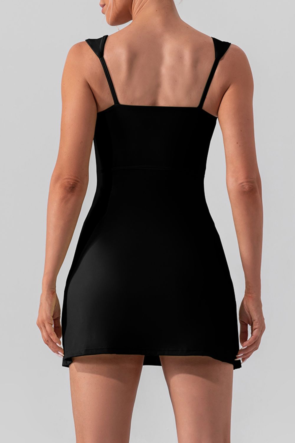 Chic square neck sleeveless mini dress with a stylish slit, perfect for active and casual wear.