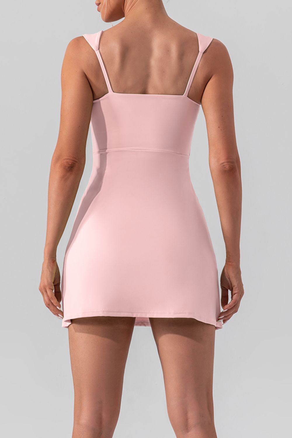 Chic square neck sleeveless mini dress with a stylish slit, perfect for active and casual wear.