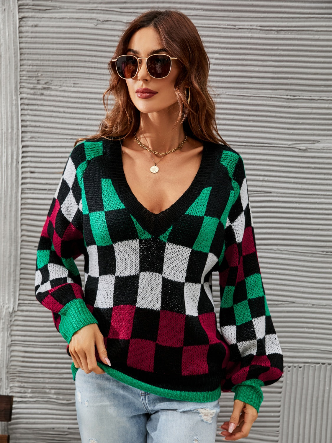 Trendy checkered v-neck sweater with lantern sleeves, perfect for a cozy and stylish look.