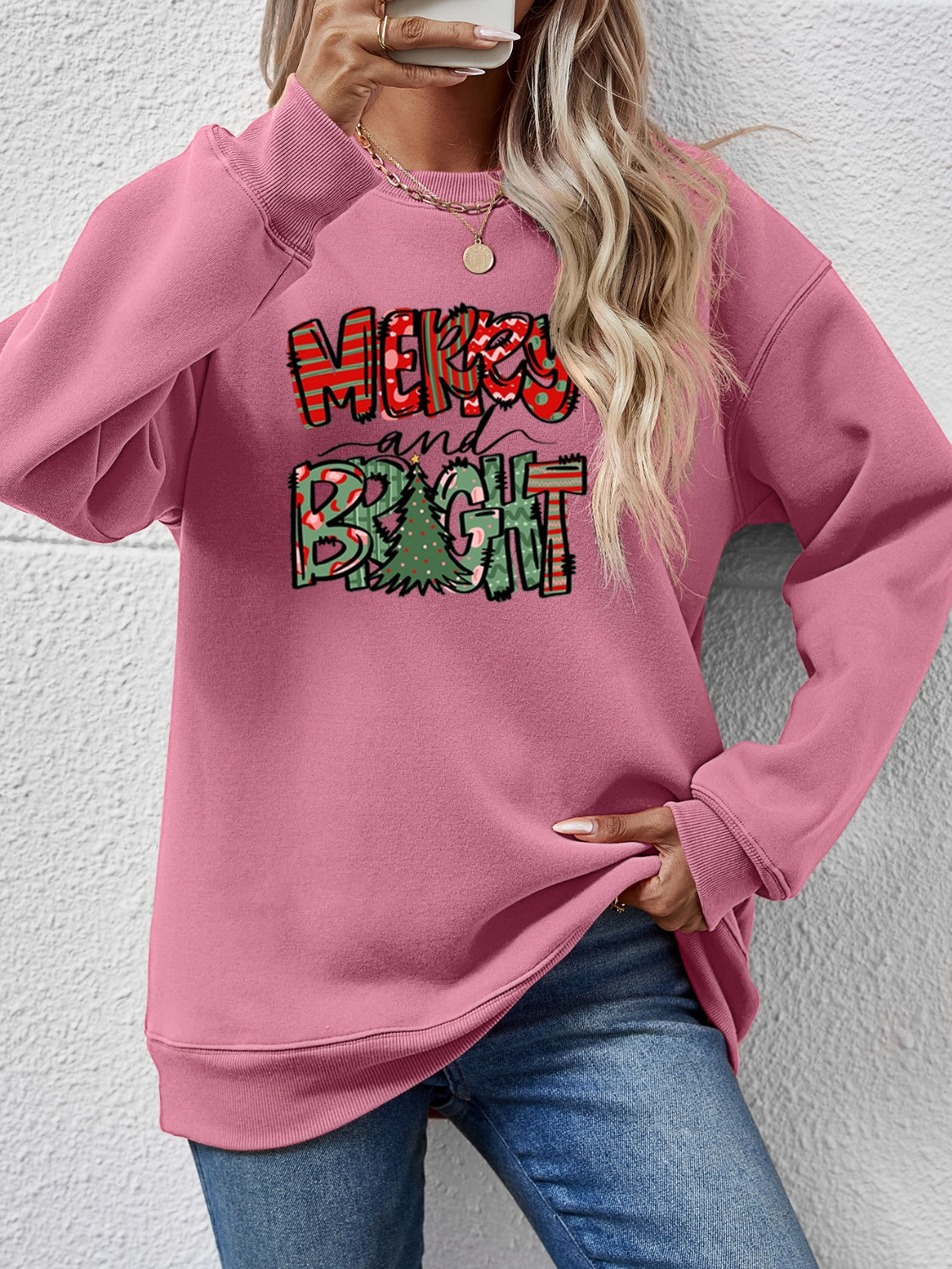 Festive ‘MERRY AND BRIGHT’ long sleeve sweatshirt, perfect for holiday cheer and cozy style.