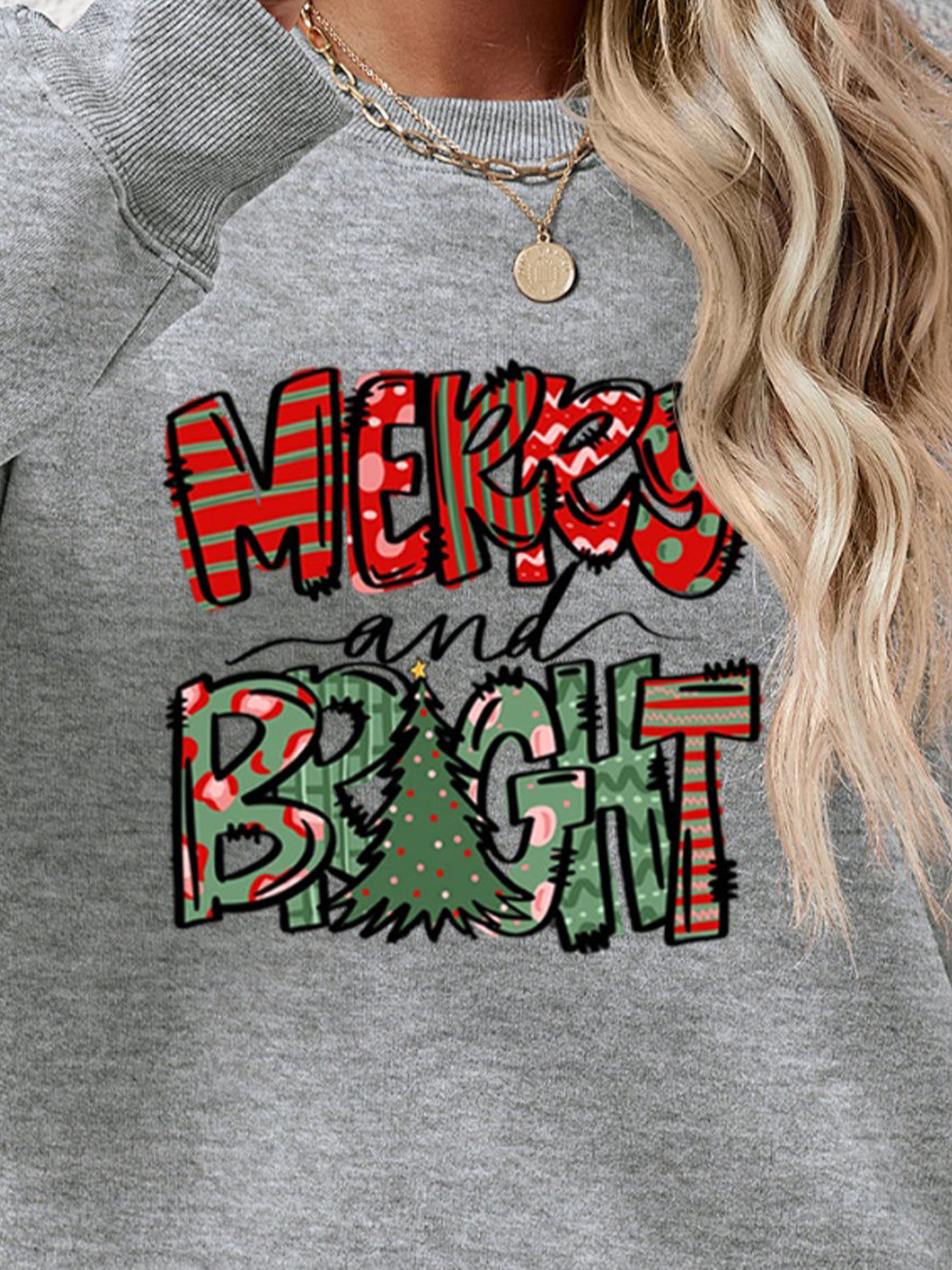 Festive ‘MERRY AND BRIGHT’ long sleeve sweatshirt, perfect for holiday cheer and cozy style.