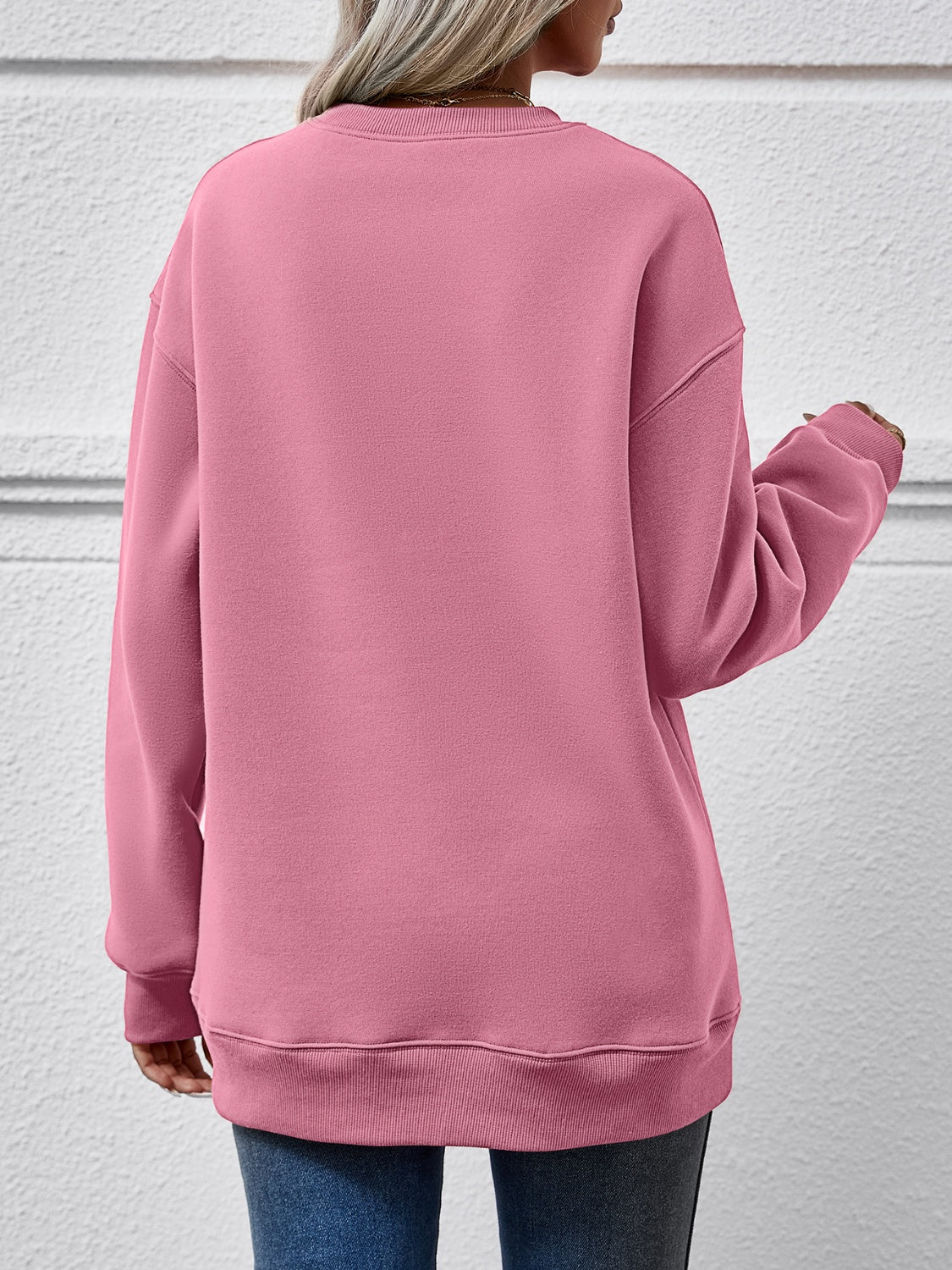 Festive ‘MERRY AND BRIGHT’ long sleeve sweatshirt, perfect for holiday cheer and cozy style.