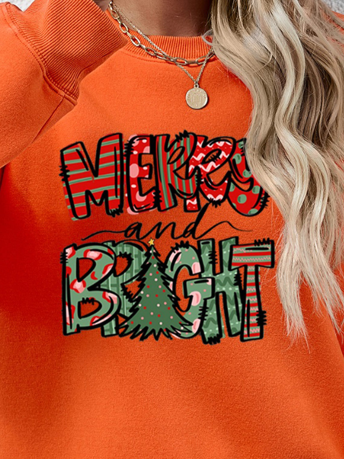 Festive ‘MERRY AND BRIGHT’ long sleeve sweatshirt, perfect for holiday cheer and cozy style.