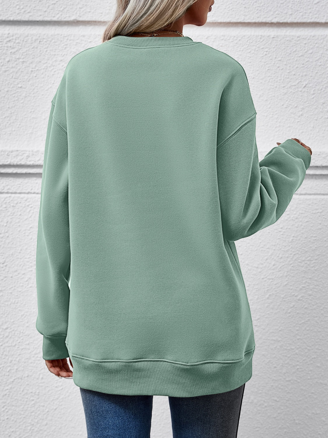 Festive ‘MERRY AND BRIGHT’ long sleeve sweatshirt, perfect for holiday cheer and cozy style.