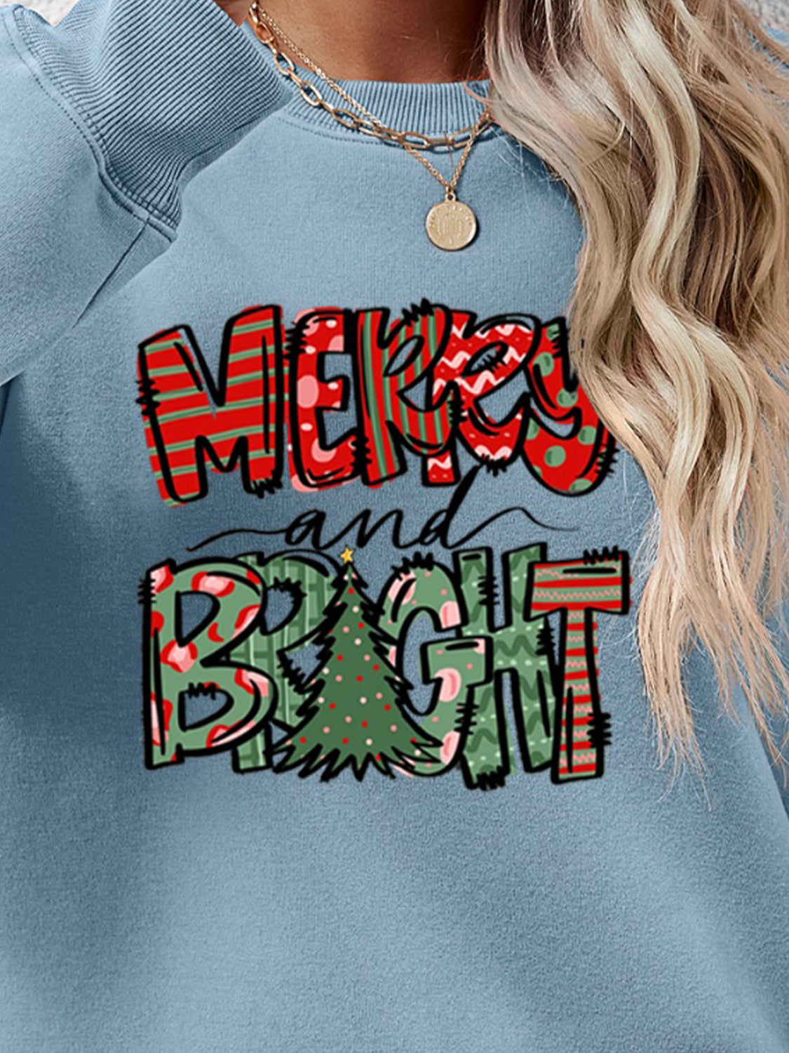 Festive ‘MERRY AND BRIGHT’ long sleeve sweatshirt, perfect for holiday cheer and cozy style.