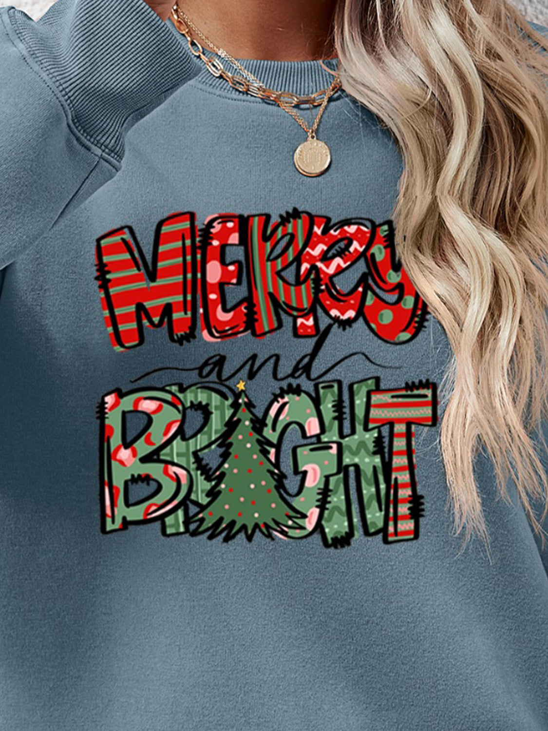 Festive ‘MERRY AND BRIGHT’ long sleeve sweatshirt, perfect for holiday cheer and cozy style.
